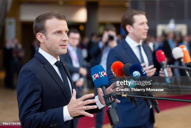France's President Emmanuel Macron and the Austrian Chancellor Sebastian Kurz speak to journalists as he arrives to take part in the second day of...
