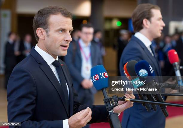 France's President Emmanuel Macron and the Austrian Chancellor Sebastian Kurz speak to journalists as he arrives to take part in the second day of...