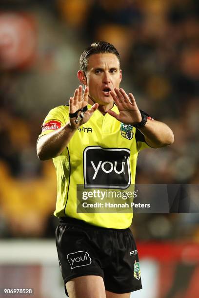 Referee Adam Gee gives a penalty during the round 16 NRL match between the New Zealand Warriors and the Cronulla Sharks at Mt Smart Stadium on June...