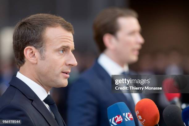 France's President Emmanuel Macron and the Austrian Chancellor Sebastian Kurz speak to journalists as he arrives to take part in the second day of...