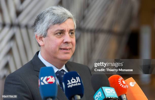 Portuguese Finance Minister, President of the group Mario Centeno speaks to journalists as he arrives to take part in the second day of the European...