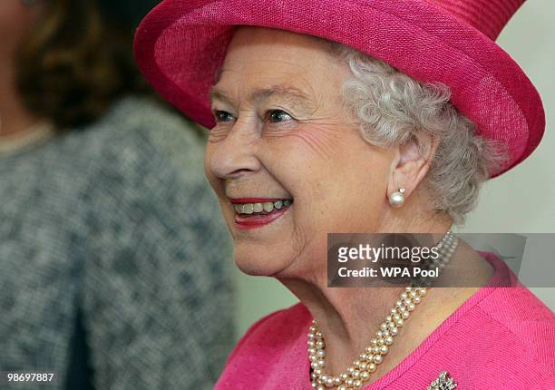 Queen Elizabeth II smiles as she attends lunch at Bangor University's Business School on April 27, 2010 in Bangor, Wales. The Queen and Duke of...