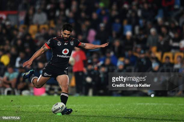 Shaun Johnson kicks at goal during the round 16 NRL match between the New Zealand Warriors and the Cronulla Sharks at Mt Smart Stadium on June 29,...