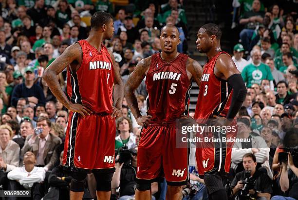 Dorell Wright, Quentin Richardson and Dwyane Wade of the Miami Heat huddle on the court in Game Two of the Eastern Conference Quarterfinals against...