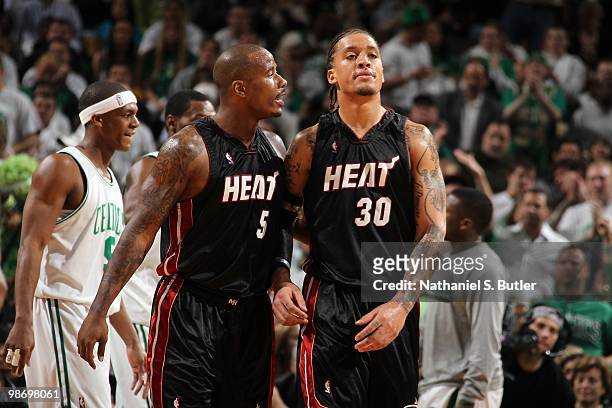 Quentin Richardson and Michael Beasley of the Miami Heat talk on the court in Game One of the Eastern Conference Quarterfinals against the Boston...