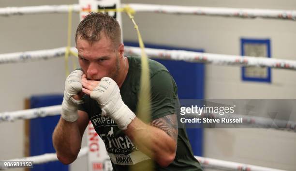Brandon Cook dips under a rope throwing short punches and practicing defence. Ajax super welterweight boxer Brandon Cook has battled his way into...
