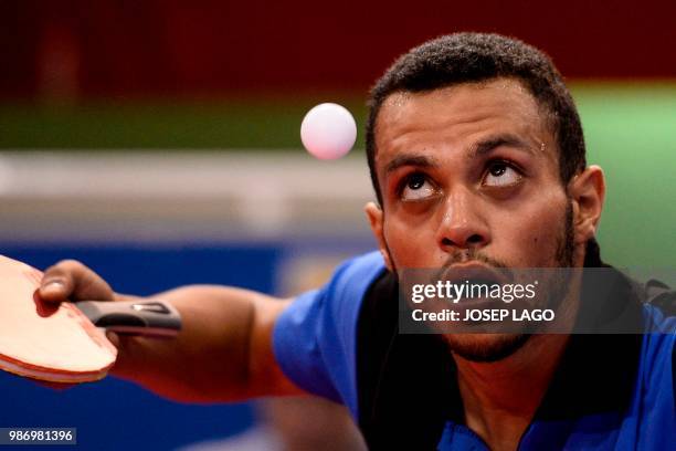 Tunisian Kerem Ben Yahia returns the ball to Egyptian Khaled Assar during their men's table tennis group A team match 1 at the XVIII Mediterranean...