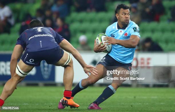 Kurtley Beale of the Waratahs runs with the ball during the round 17 Super Rugby match between the Rebels and the Waratahs at AAMI Park on June 29,...