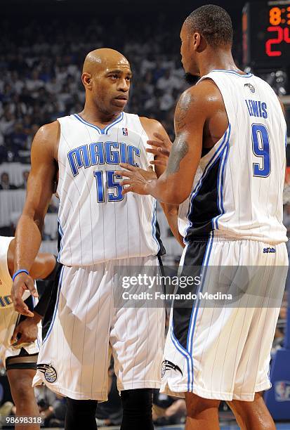 Vince Carter and Rashard Lewis of the Orlando Magic talk strategy in Game One of the Eastern Conference Quarterfinals against the Charlotte Bobcats...