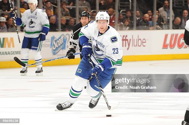 Alexander Edler of the Vancouver Canucks skates with the puck against the Los Angeles Kings in Game Six of the Western Conference Quarterfinals...