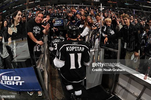 Anze Kopitar of the Los Angeles Kings gives his stick to a fan after being defeated by the Vancouver Canucks in Game Six of the Western Conference...