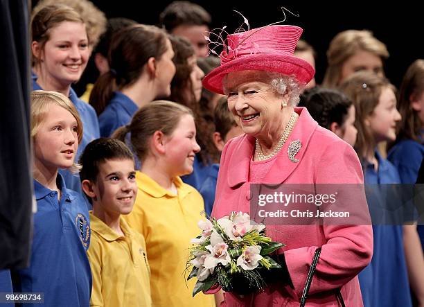 Queen Elizabeth II meets schoolchildren as she visits the Venue Cymru Arena on April 27, 2010 in Llandudno, Wales. The Queen and Duke of Edinburgh...