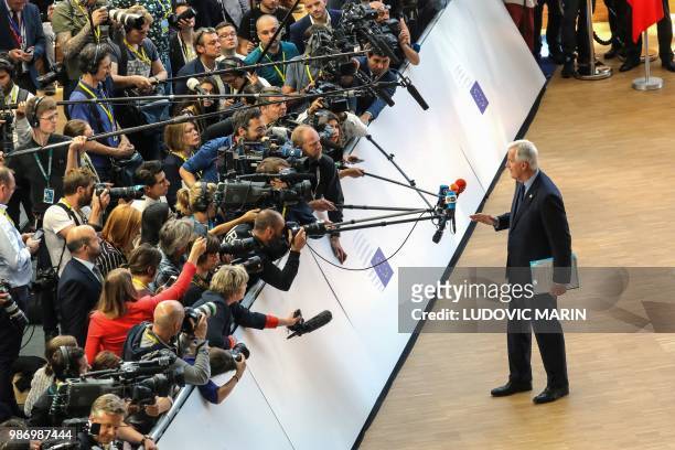 Brexit Chief Negotiator Michel Barnier speaks to journalists during the last day of the European Union leaders' summit, without Britain, to discuss...