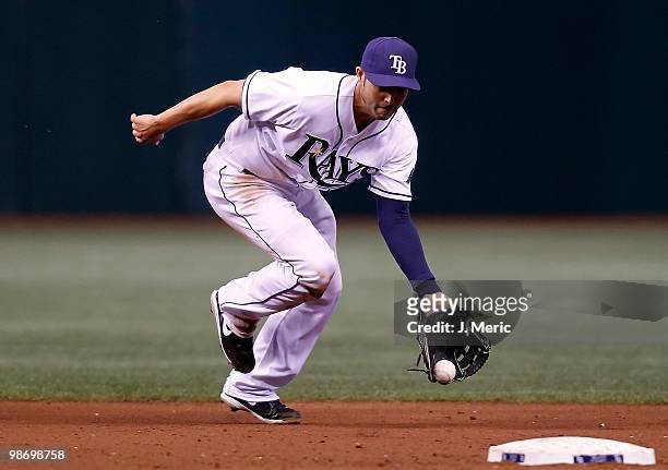 Shortstop Jason Bartlett of the Tampa Bay Rays fields a ground ball against the Toronto Blue Jays during the game at Tropicana Field on April 24,...