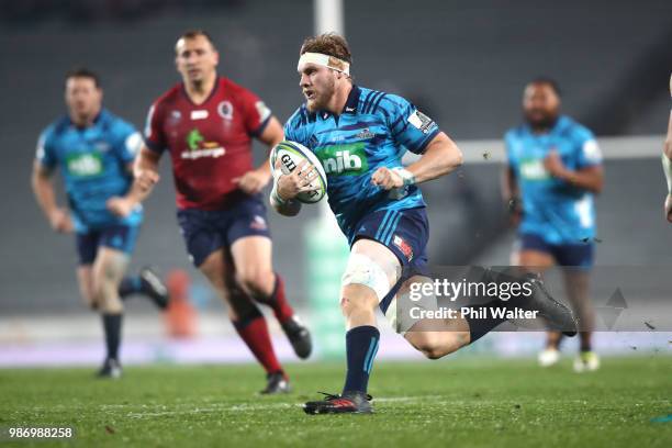 Blake Gibson of the Blues makes a break during the round 17 Super Rugby match between the Blues and the Reds at Eden Park on June 29, 2018 in...