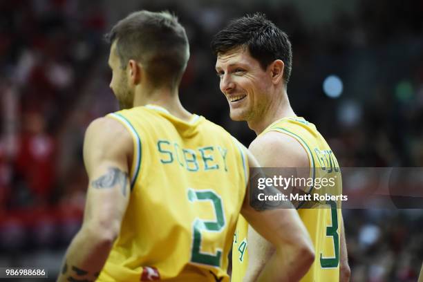 Cameron Gliddon of Australia shares a laugh with Nathan Sobey during the FIBA World Cup Asian Qualifier Group B match between Japan and Australia at...