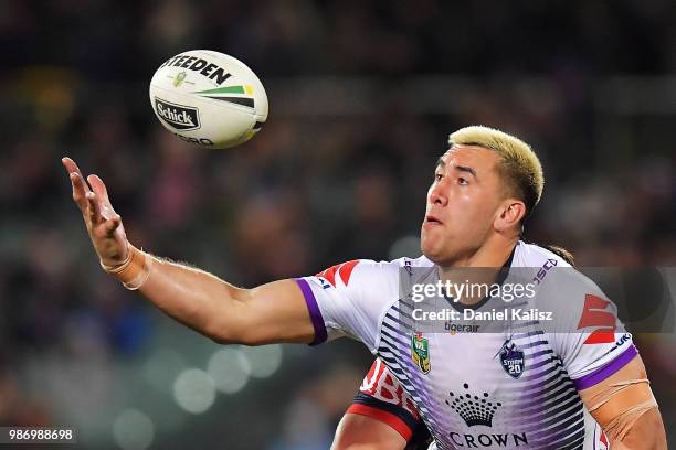 Nelson Asofa-Solomona of the Storm competes for the ball during the round 16 NRL match between the Sydney Roosters and the Melbourne Storm at...