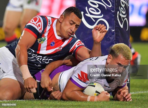 Nelson Asofa-Solomona of the Storm scores a try during the round 16 NRL match between the Sydney Roosters and the Melbourne Storm at Adelaide Oval on...