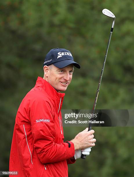 Jim Furyk waits on the practice ground during a practice round prior to the start of the 2010 Quail Hollow Championship at the Quail Hollow Club on...