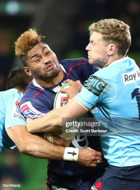 Amanaki Mafi of the Rebels is tackled during the round 17 Super Rugby match between the Rebels and the Waratahs at AAMI Park on June 29, 2018 in...