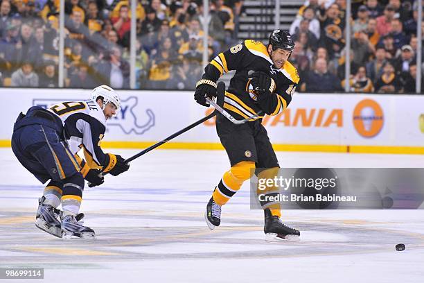 Marco Sturm of the Boston Bruins skates after the puck against Jason Pominville of the Buffalo Sabres in Game Six of the Eastern Conference...