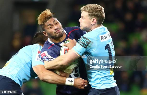 Amanaki Mafi of the Rebels is tackled during the round 17 Super Rugby match between the Rebels and the Waratahs at AAMI Park on June 29, 2018 in...