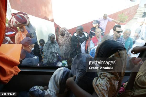 African migrants who were arrested in Algeria while illegally attempting to get to Europe, leave the refugee camp located in the Zeralda region,...