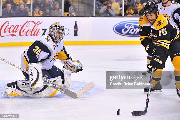 Ryan Miller of the Buffalo Sabres watches the puck against Marco Sturm of the Boston Bruins in Game Six of the Eastern Conference Quarterfinals...