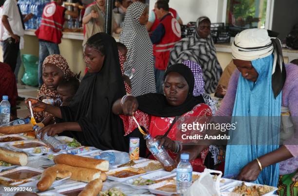 African migrants who were arrested in Algeria while illegally attempting to get to Europe, have meal before leaving the refugee camp located in the...