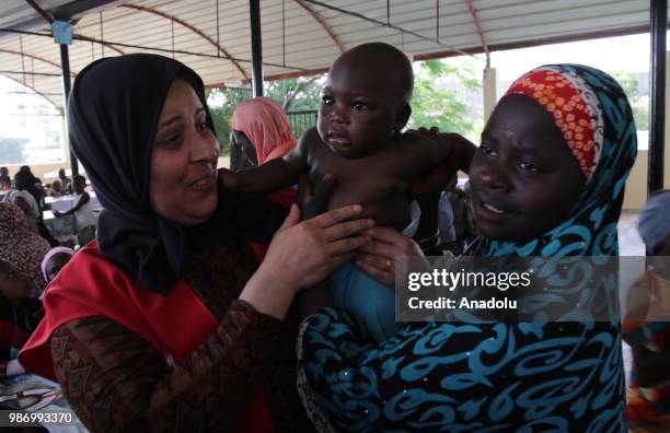 African migrants who were arrested in Algeria while illegally attempting to get to Europe, leave the refugee camp located in the Zeralda region,...