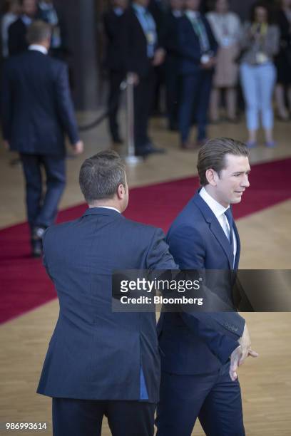 Xavier Bettel, Luxembourg's prime minister, left, greets Sebastian Kurz, Austria's chancellor, as they arrive for a European Union leaders summit in...