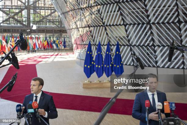 Emmanuel Macron, France's president, left, and Sebastian Kurz, Austria's chancellor, speak to the media as they arrive for a European Union leaders...