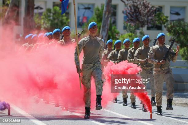 Officer candidates parade after they completed 43 weeks commando basic course at Foca Gendarmerie Commando School and Training Center Command in...