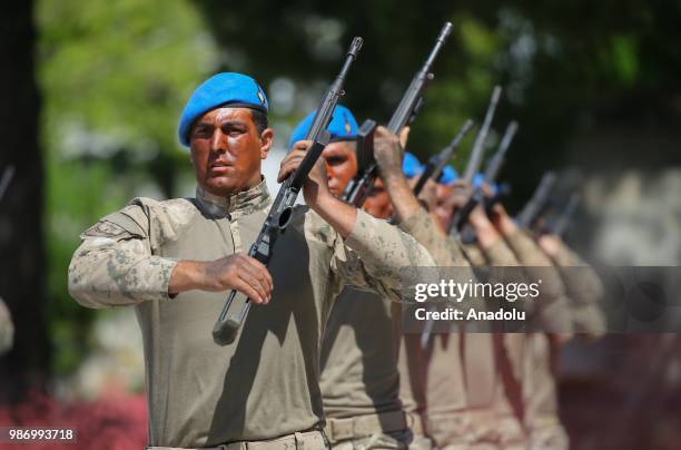 Officer candidates parade after they completed 43 weeks commando basic course at Foca Gendarmerie Commando School and Training Center Command in...