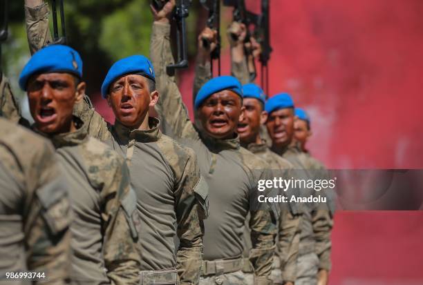 Officer candidates parade after they completed 43 weeks commando basic course at Foca Gendarmerie Commando School and Training Center Command in...