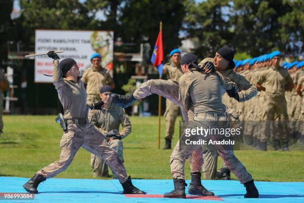 Officer candidates performs as they parade after they completed 43 weeks commando basic course at Foca Gendarmerie Commando School and Training...