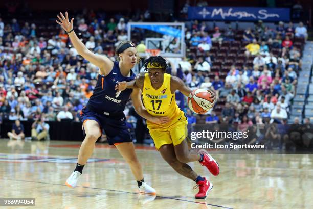 Indiana Fever guard Erica Wheeler drives past Connecticut Sun guard Rachel Banham during a WNBA game between Indiana Fever and Connecticut Sun on...