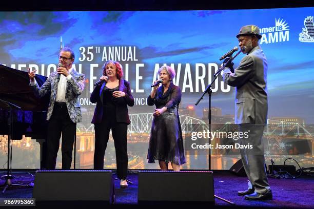 Hubert Laws and The Manhattan Transfer perform on stage during the National Music Council American Eagle Awards Dinner honoring Chick Corea and The...