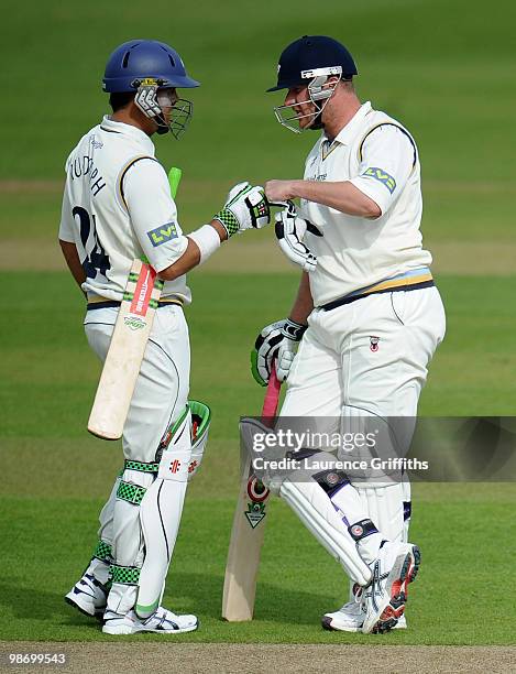 Jacques Rudolph and Anthony McGrath of Yorkshire pile on the runs during the LV County Championship match between Yorkshire and Durham at Headingley...