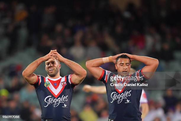 Sydney Roosters players look on dejected during the round 16 NRL match between the Sydney Roosters and the Melbourne Storm at Adelaide Oval on June...