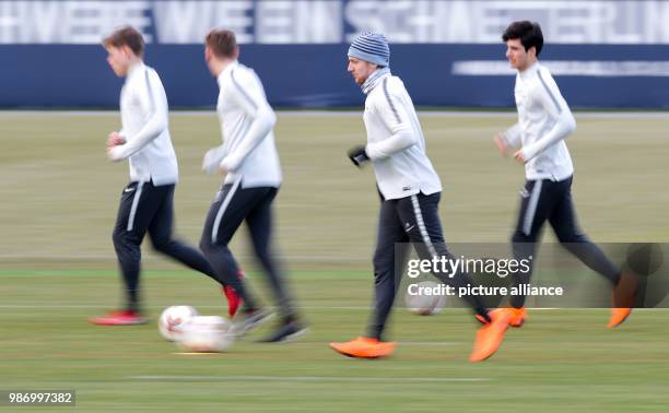 February 2018, Germany, Leipzig, Europa League, RB Leipzig vs. SSC Napoli, round of the last 32. Leipzig's players surrounding Emil Forsberg...