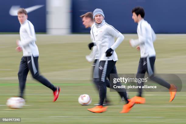 February 2018, Germany, Leipzig, Europa League, RB Leipzig vs. SSC Napoli, round of the last 32. Leipzig's players surrounding Emil Forsberg...