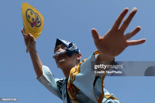 People perform Awa Dance in Tokushima City, Tokushima Prefecture in western Japan on Jun. 29, 2018.