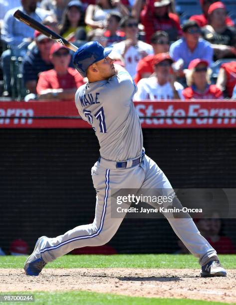 Luke Maile of the Toronto Blue Jays at bat in the game against the Los Angeles Angels of Anaheim at Angel Stadium on June 24, 2018 in Anaheim,...