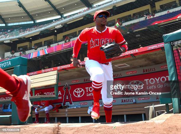 Justin Upton of the Los Angeles Angels of Anaheim runs on to the field at the start of the game against the Toronto Blue Jays of Anaheim at Angel...