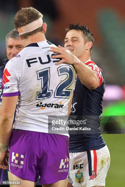 Ryan Hoffman of the Storm and Cooper Cronk of the Roosters embrace after the round 16 NRL match between the Sydney Roosters and the Melbourne Storm...