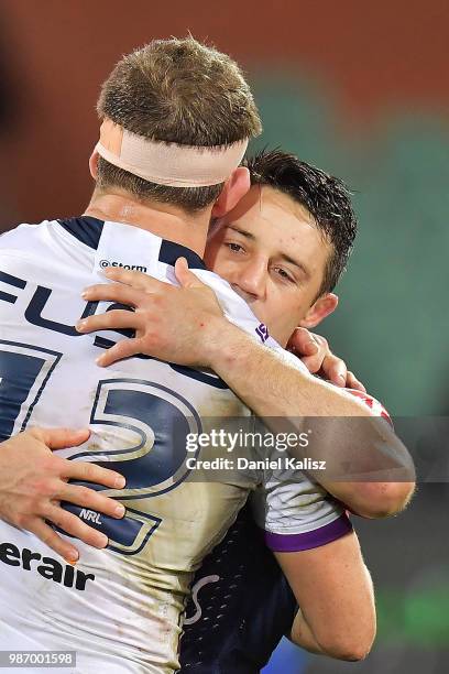 Ryan Hoffman of the Storm and Cooper Cronk of the Roosters embrace after the round 16 NRL match between the Sydney Roosters and the Melbourne Storm...