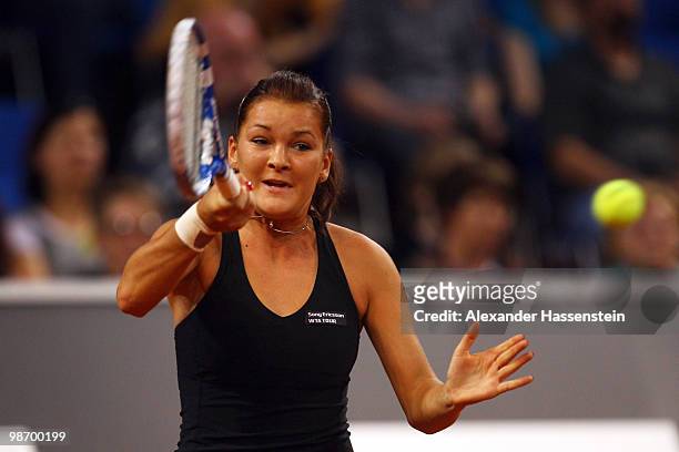 Agnieszka Radwanska of Poland plays a fore hand during her first round match against Ana Ivanovic of Serbia at day two of the WTA Porsche Tennis...