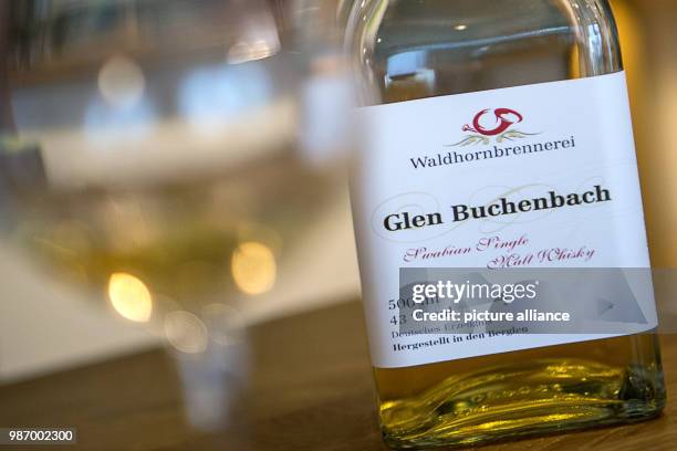 February 2018, Germany, Berglen: A bottle of 'Glen Buchenbach' stands on the table of the Waldhorn distillery's shop. The European Court of Justice...