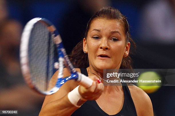 Agnieszka Radwanska of Poland plays a fore hand during her first round match against Ana Ivanovic of Serbia at day two of the WTA Porsche Tennis...